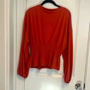 Women’s Pink Lily long sleeve sweater top coral color. Size M